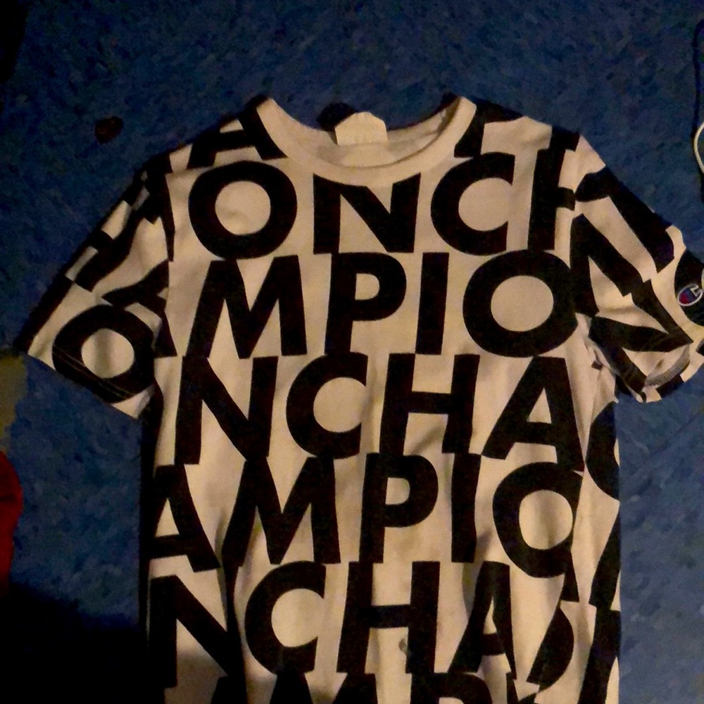 White champion shirt with the champion written all over
